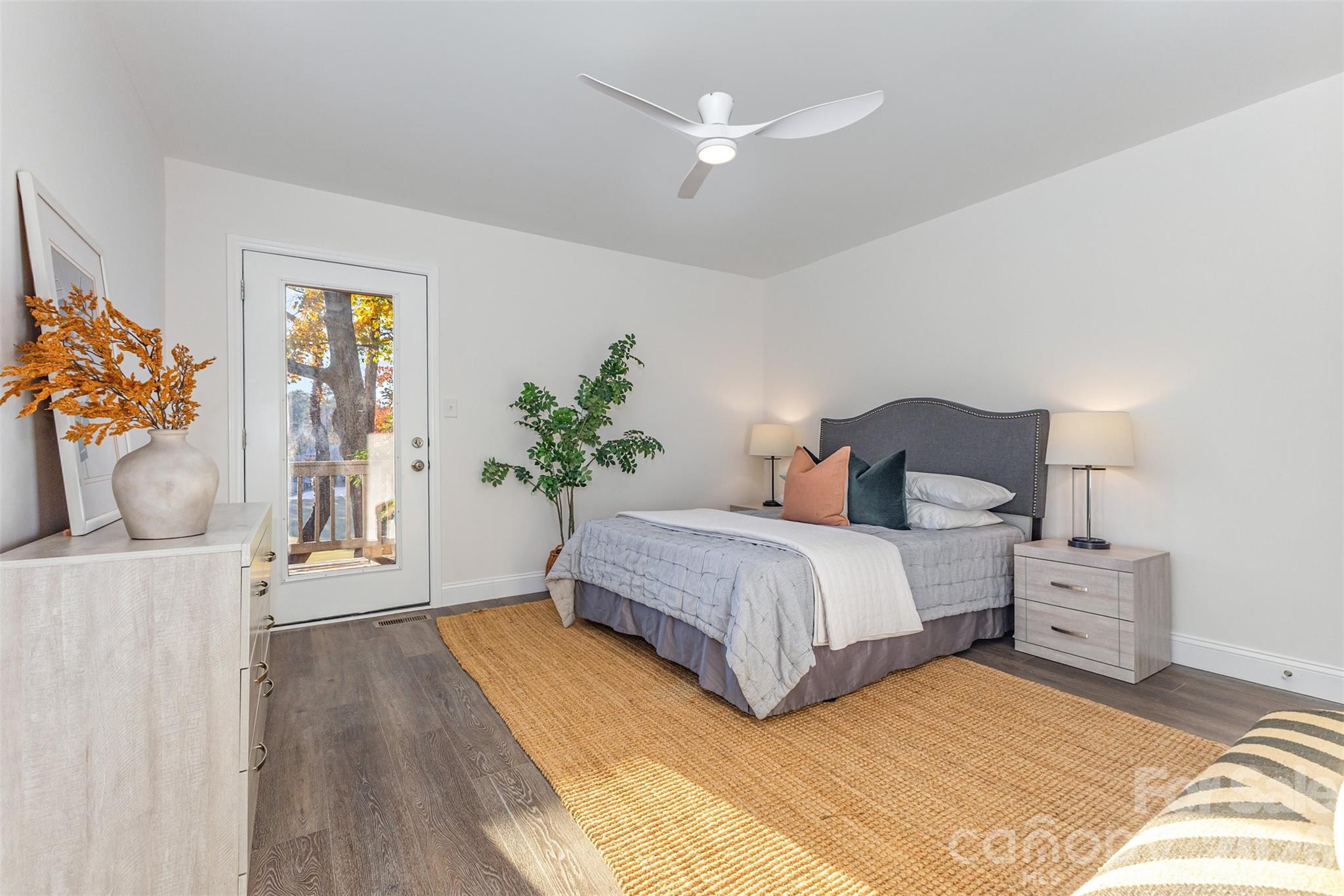 1184 Molokai Drive Fort Mill, SC 29708 - Photo 17 of 35 a spacious bedroom with a bed and a potted plant