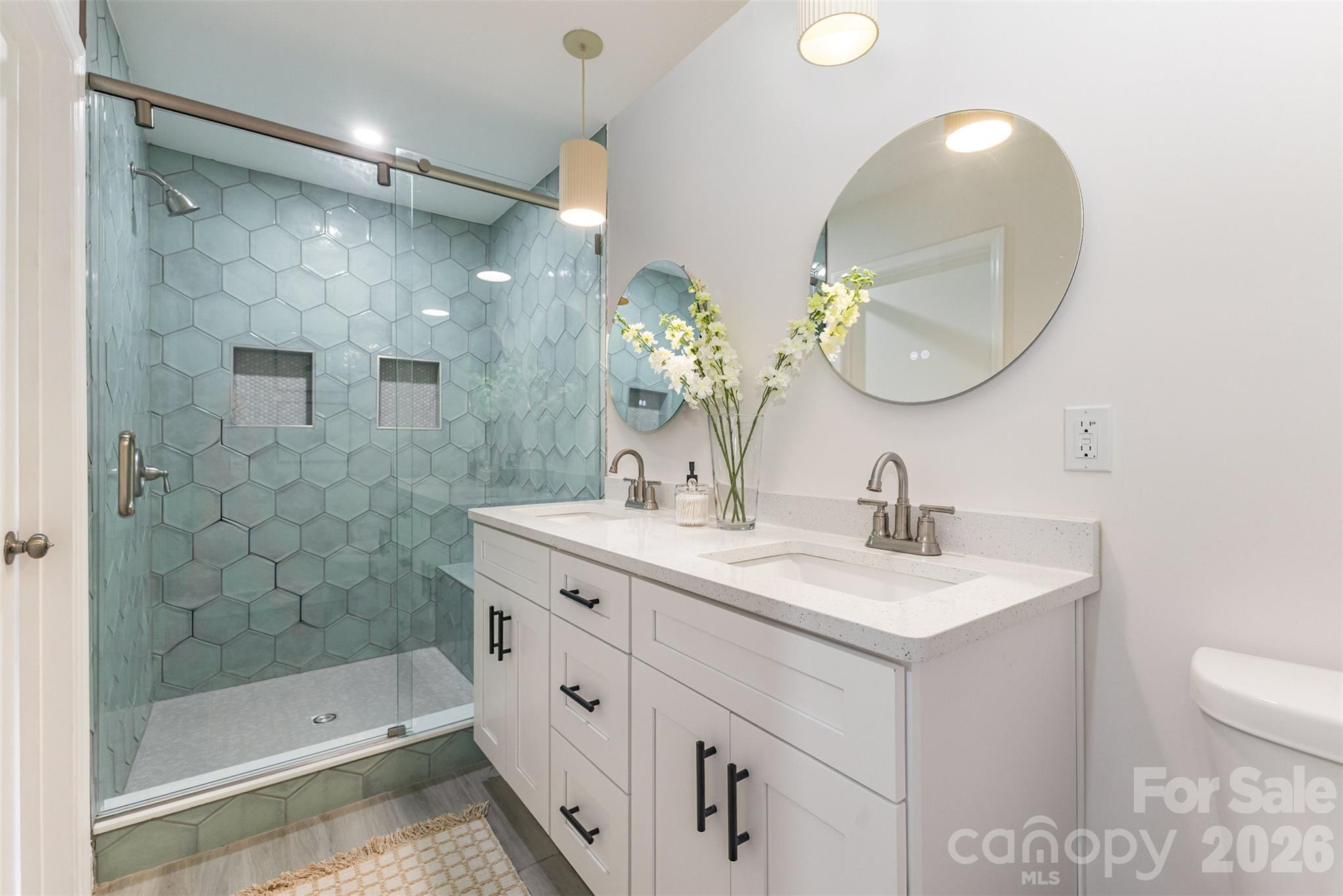 1184 Molokai Drive Fort Mill, SC 29708 - Photo 18 of 35 a bathroom with a double vanity sink mirror and shower