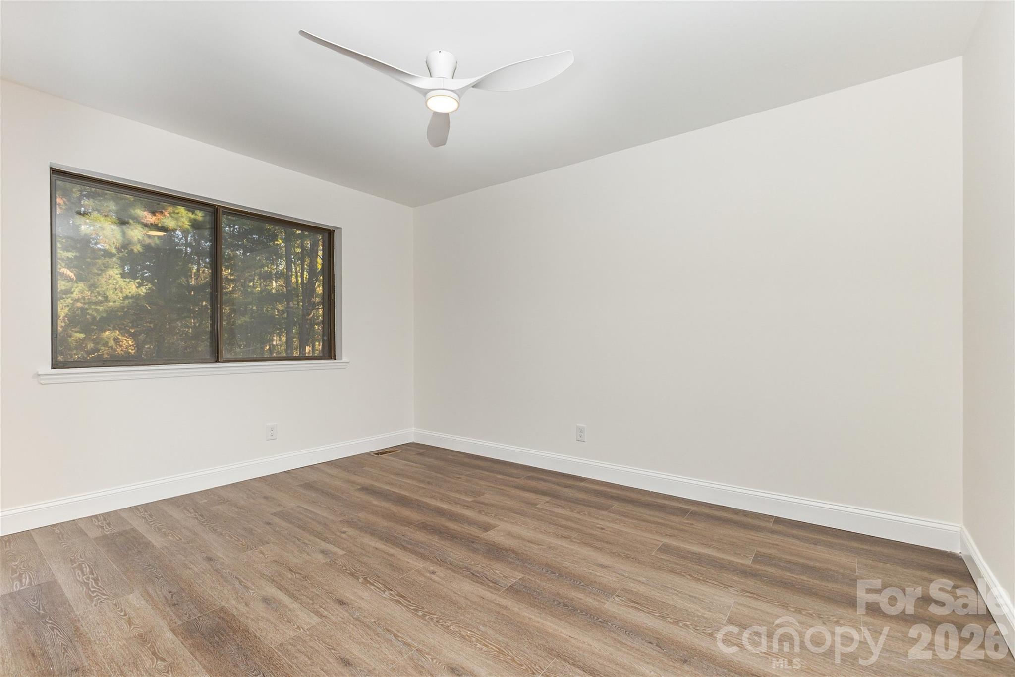 1184 Molokai Drive Fort Mill, SC 29708 - Photo 21 of 35 an empty room with wooden floor and windows