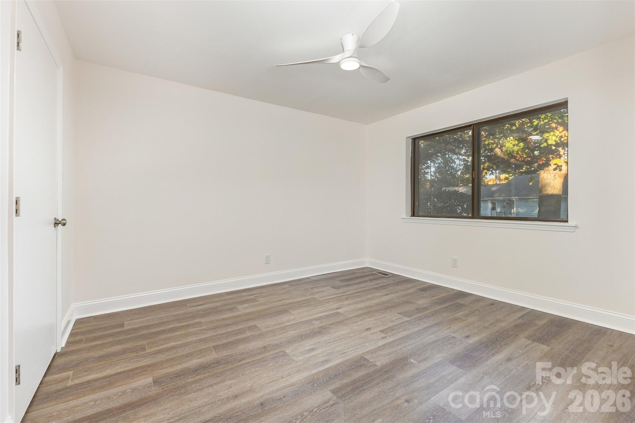 1184 Molokai Drive Fort Mill, SC 29708 - Photo 23 of 35 an empty room with wooden floor and windows