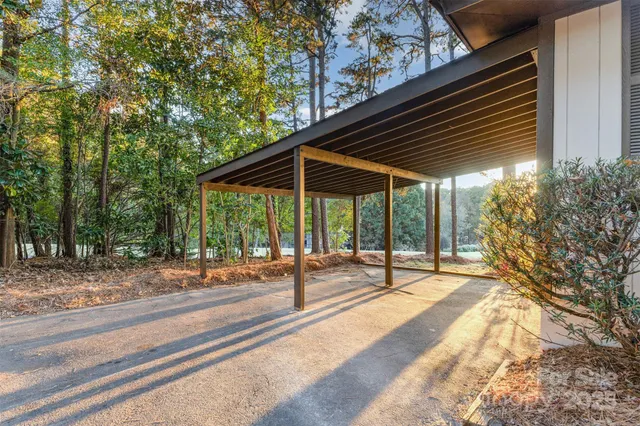 a view of a yard with a house in the background