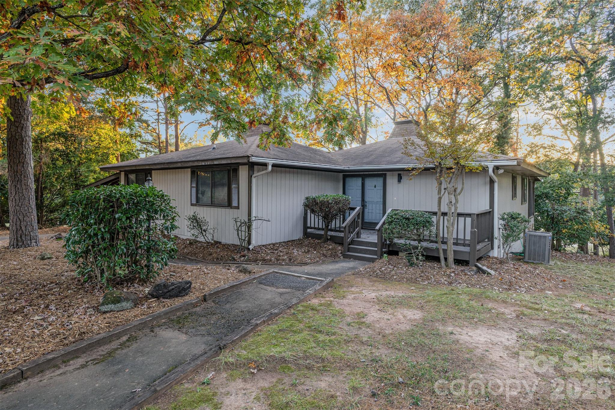 1184 Molokai Drive Fort Mill, SC 29708 - Photo 3 of 35 a view of a patio with table and chairs under an umbrella