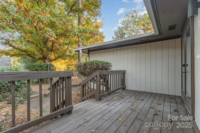 a view of balcony with wooden floor