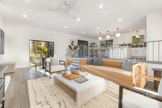 a living room with furniture and a table