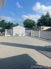152 South Country Road, Unit B Bellport, NY 11713 - Photo 2 of 8 a view of swimming pool with wooden fence