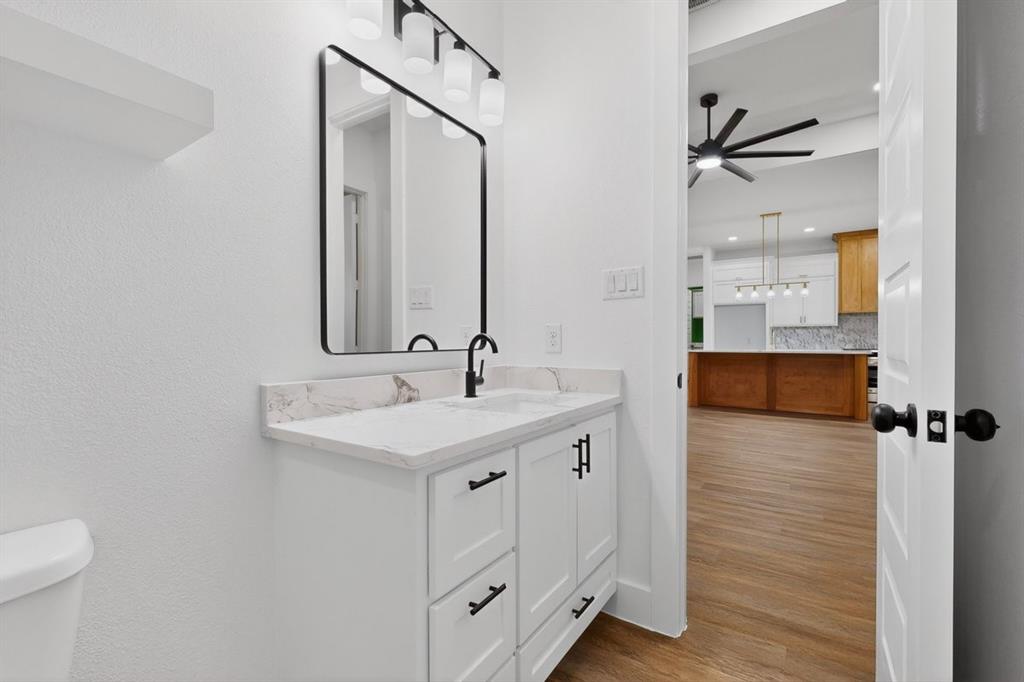 4737 Pine Ridge Court Athens, TX 75752 - Photo 17 of 26 a bathroom with a sink and a mirror