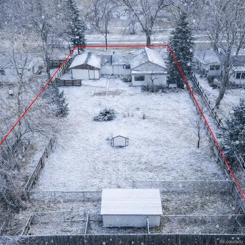 an aerial view of a house with a garden