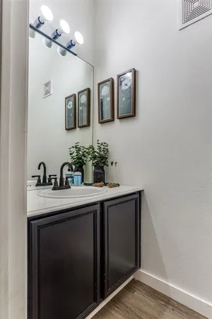 a bathroom with a sink double vanity and a mirror