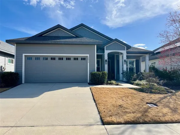 a front view of a house with yard