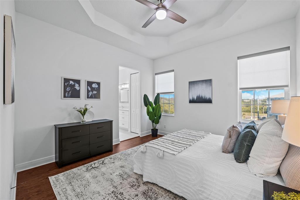 5730 Biscayne Court, Unit 6 New Port Richey, FL 34652 - Photo 12 of 55 a bedroom with a bed and a dresser