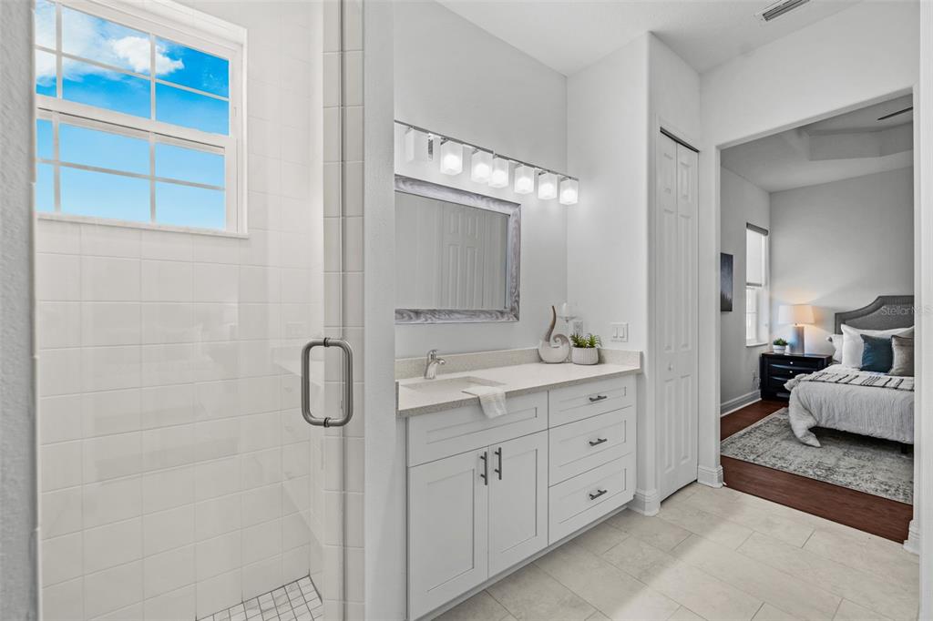 5730 Biscayne Court, Unit 6 New Port Richey, FL 34652 - Photo 14 of 55 a spacious bathroom with a double vanity sink double and mirror