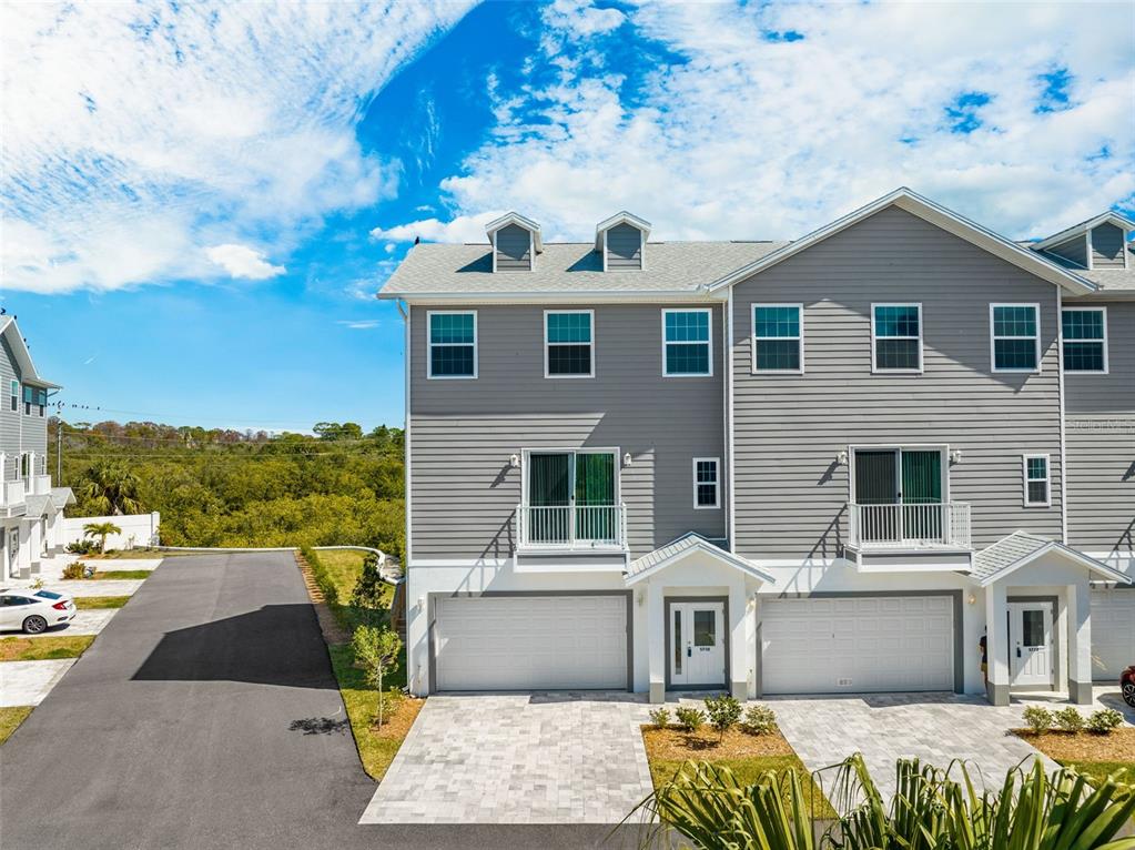 5730 Biscayne Court, Unit 6 New Port Richey, FL 34652 - Photo 29 of 55 a front view of a house with a yard