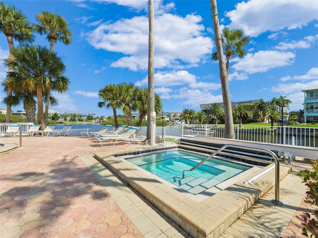 5730 Biscayne Court, Unit 6 New Port Richey, FL 34652 - Photo 39 of 55 a view of a swimming pool with a patio
