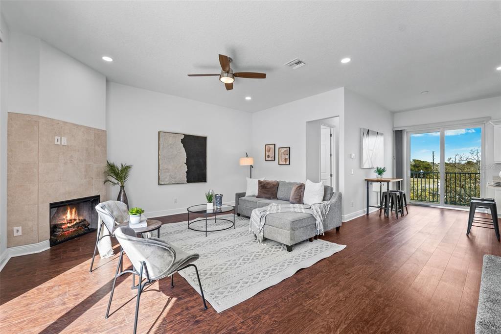 5730 Biscayne Court, Unit 6 New Port Richey, FL 34652 - Photo 4 of 55 a living room with furniture and a fireplace