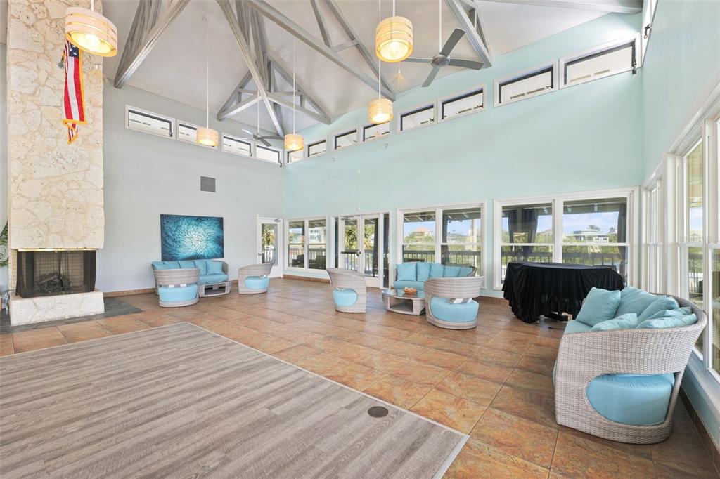 5730 Biscayne Court, Unit 6 New Port Richey, FL 34652 - Photo 42 of 55 a living room with furniture and a chandelier