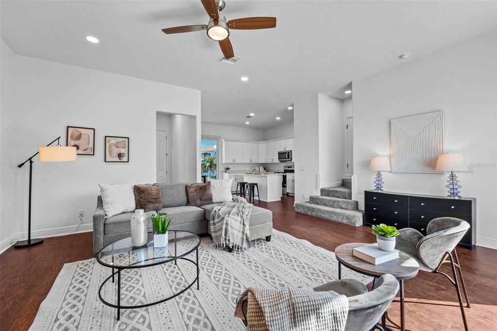 5730 Biscayne Court, Unit 6 New Port Richey, FL 34652 - Photo 5 of 55 a living room with furniture and a wooden floor