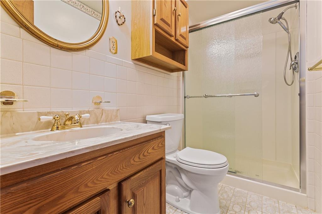 849 Falck Road McKees Rocks, PA 15136 - Photo 16 of 25 a bathroom with a sink a toilet and a shower