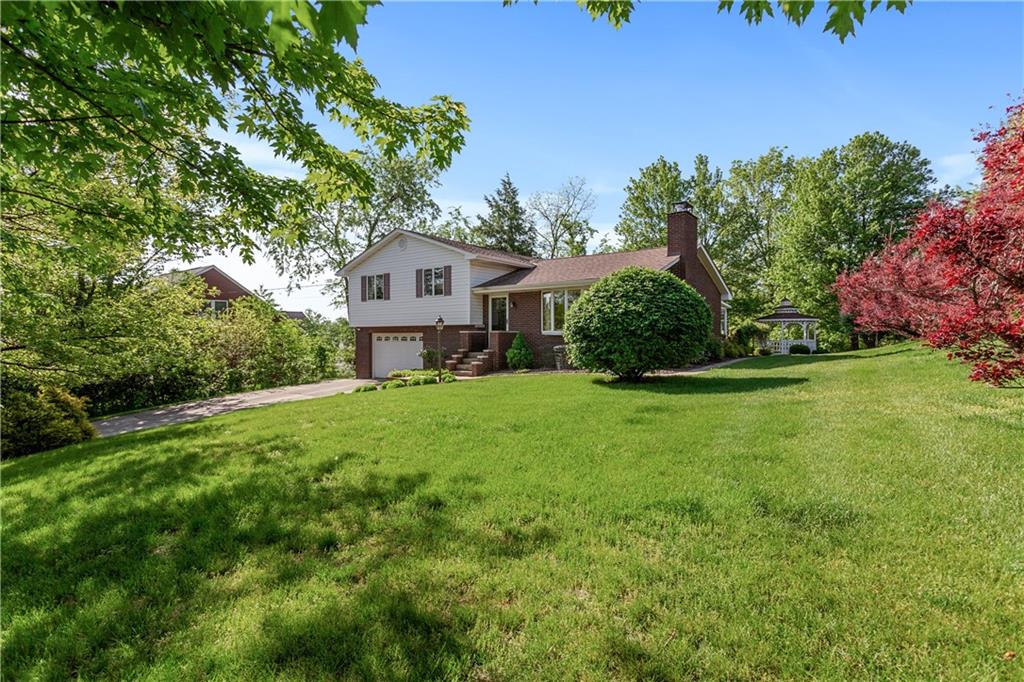 849 Falck Road McKees Rocks, PA 15136 - Photo 21 of 25 a front view of a house with a yard