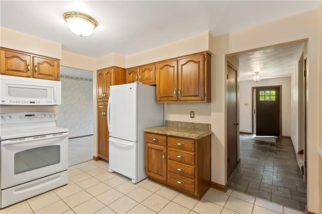 849 Falck Road McKees Rocks, PA 15136 - Photo 7 of 25 a kitchen with stainless steel appliances granite countertop a refrigerator sink and stove