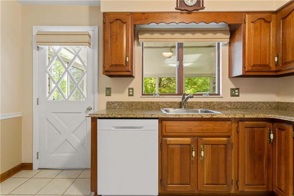 849 Falck Road McKees Rocks, PA 15136 - Photo 8 of 25 a kitchen with granite countertop a sink and a window