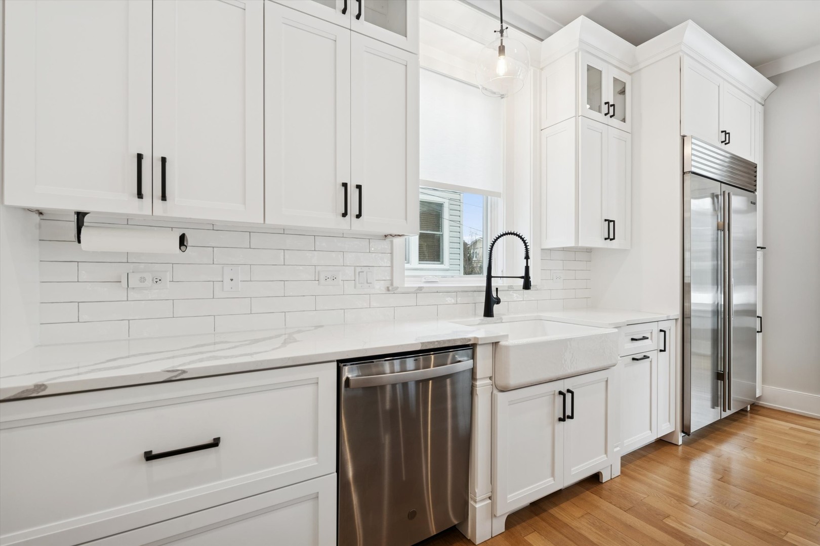 548 South Fairview Avenue Elmhurst, IL 60126 - Photo 11 of 44 a kitchen with stainless steel appliances a sink cabinets and wooden floor