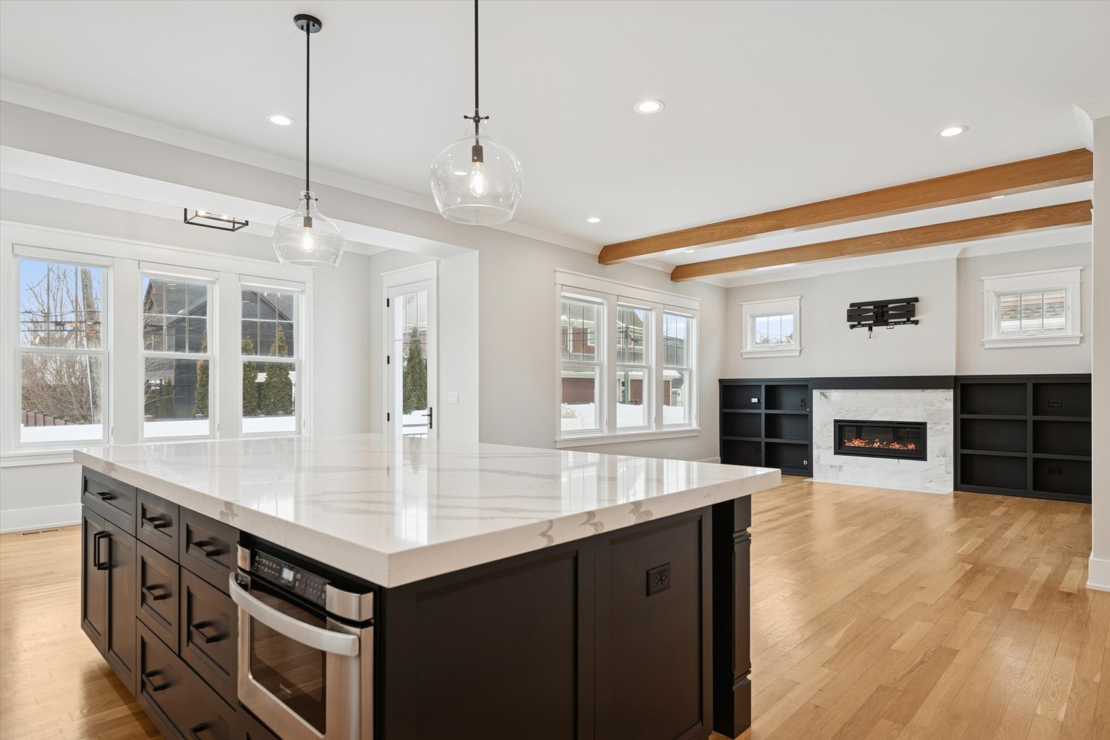 548 South Fairview Avenue Elmhurst, IL 60126 - Photo 14 of 44 a kitchen with a stove kitchen island and couches with wooden floor