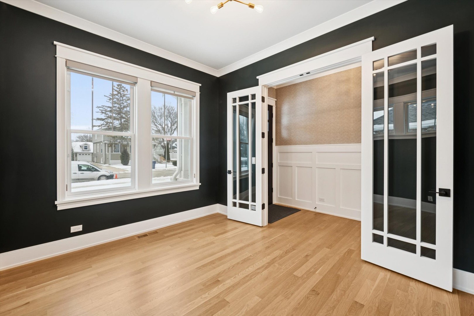 548 South Fairview Avenue Elmhurst, IL 60126 - Photo 16 of 44 a view of an empty room with a window and wooden floor