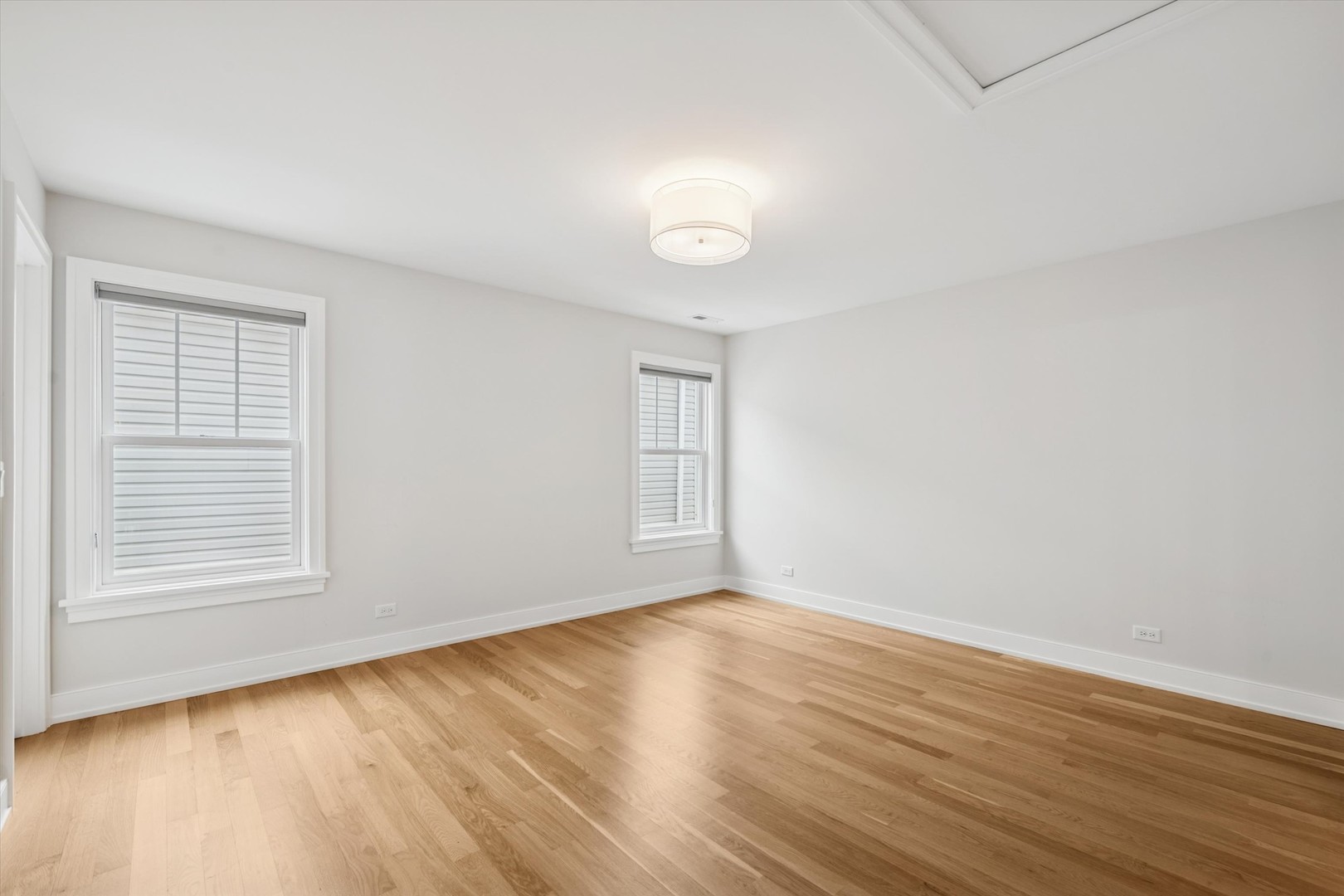 548 South Fairview Avenue Elmhurst, IL 60126 - Photo 24 of 44 an empty room with wooden floor and windows