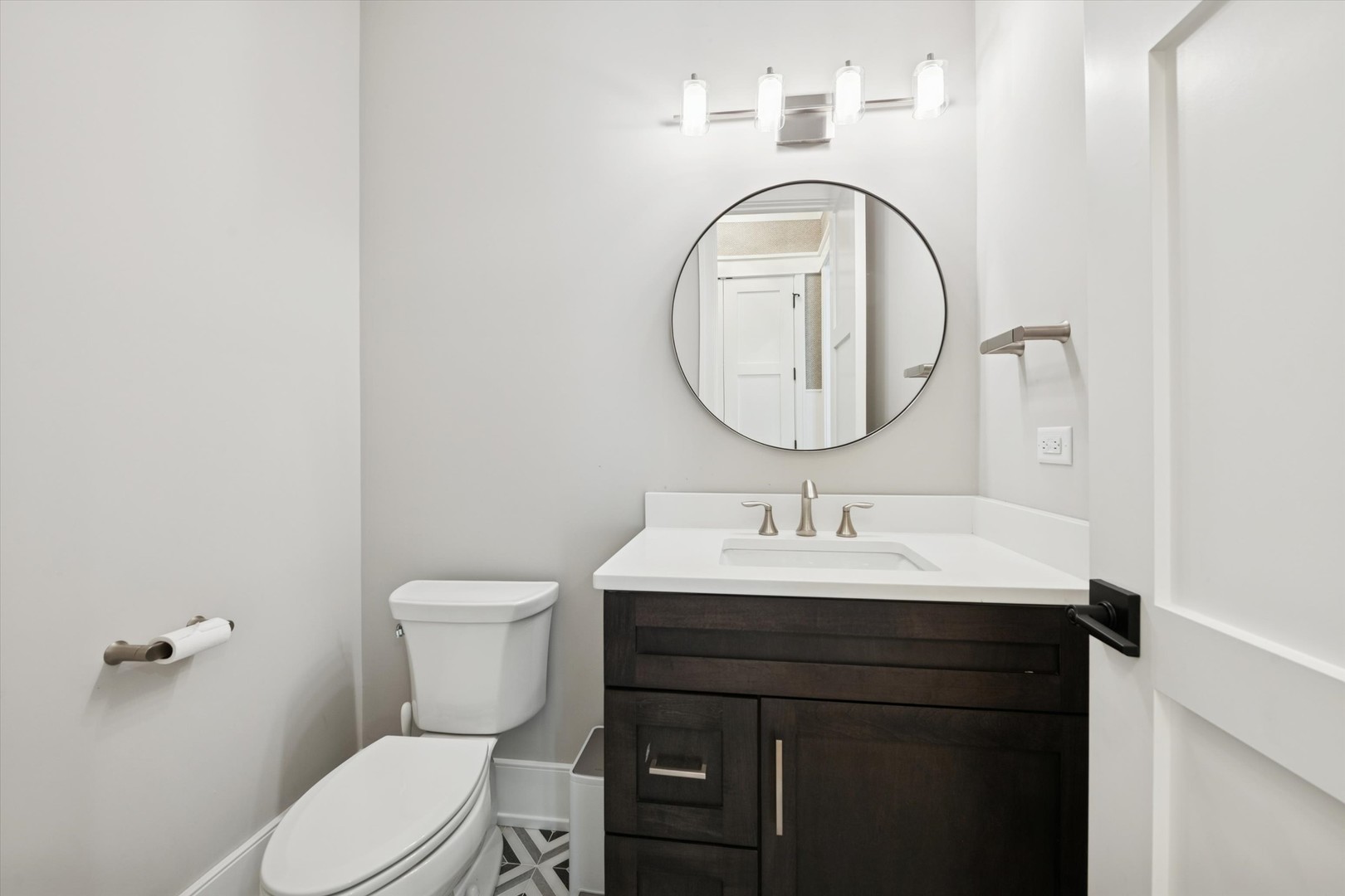 548 South Fairview Avenue Elmhurst, IL 60126 - Photo 37 of 44 a bathroom with a toilet a sink and a mirror