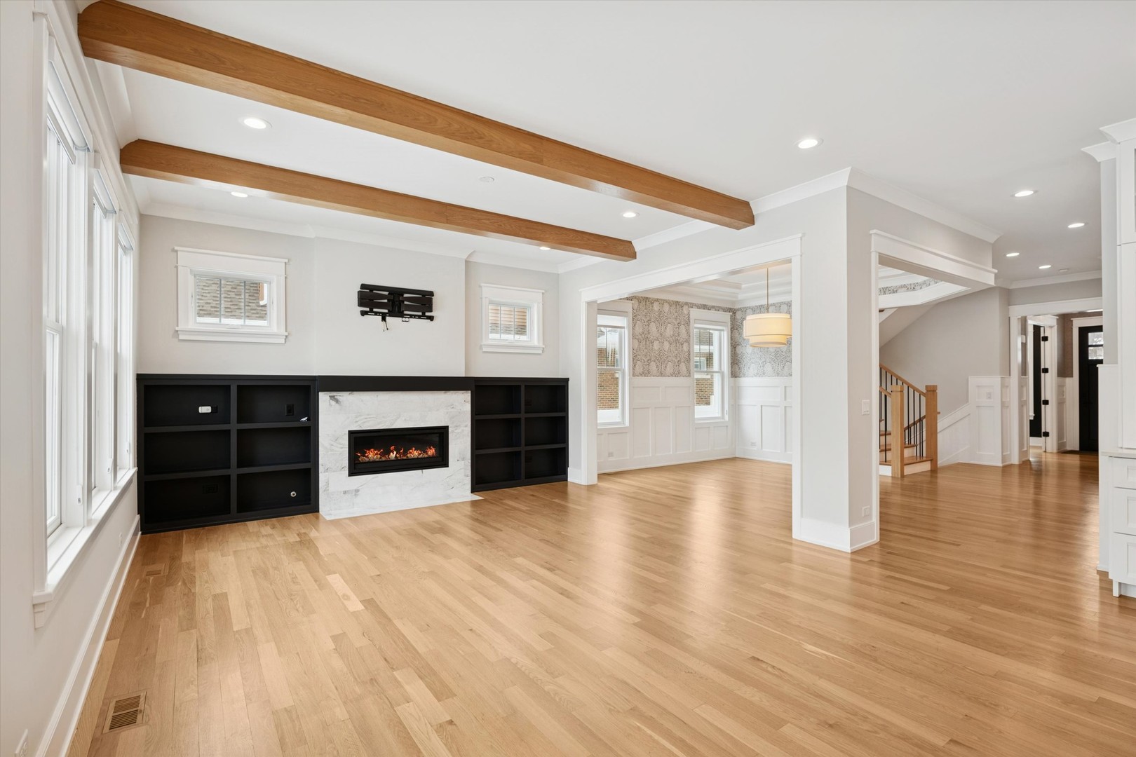 548 South Fairview Avenue Elmhurst, IL 60126 - Photo 6 of 44 a view of an empty room with wooden floor and a fireplace