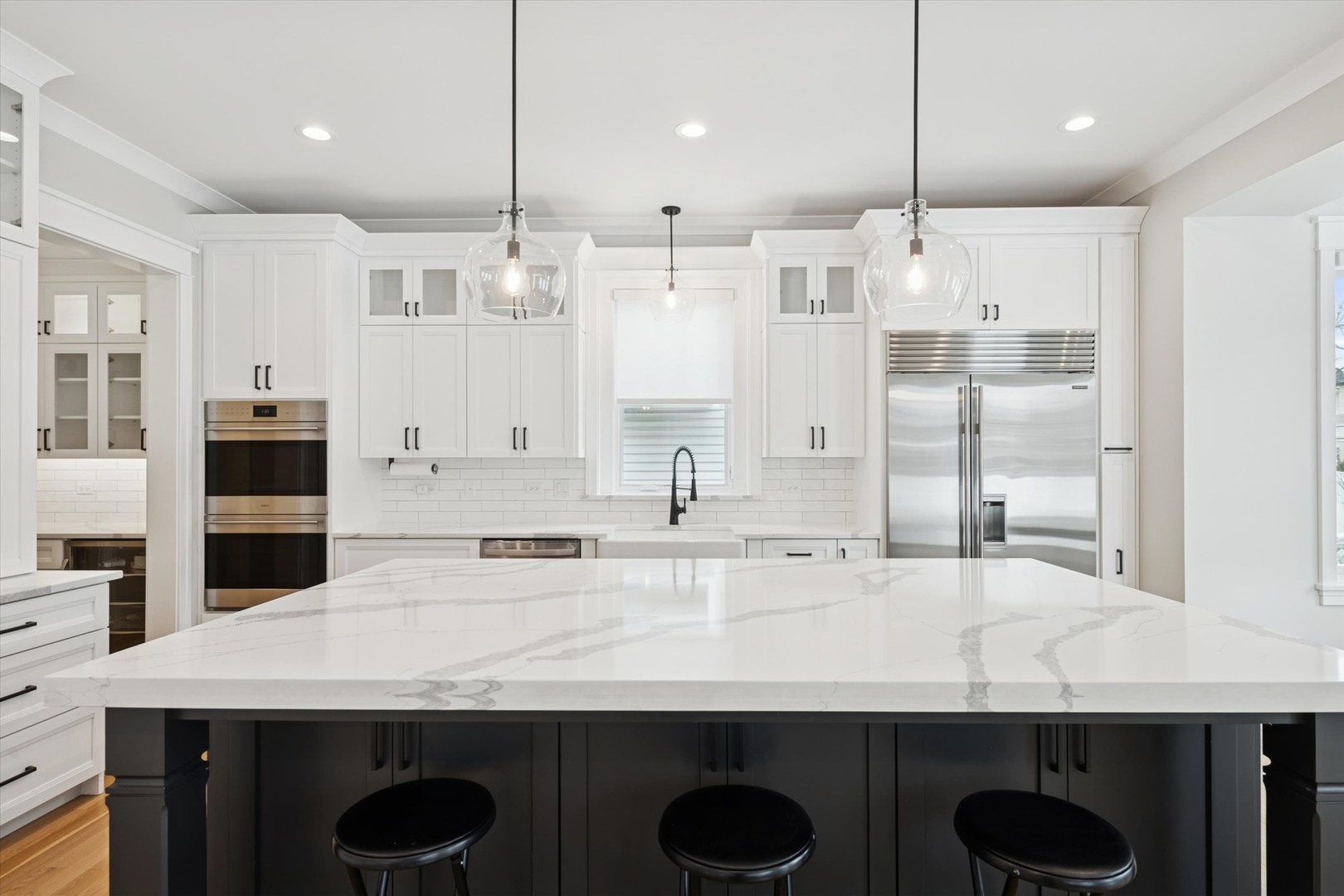 548 South Fairview Avenue Elmhurst, IL 60126 - Photo 7 of 44 a kitchen with kitchen island granite countertop a sink a center island and stainless steel appliances