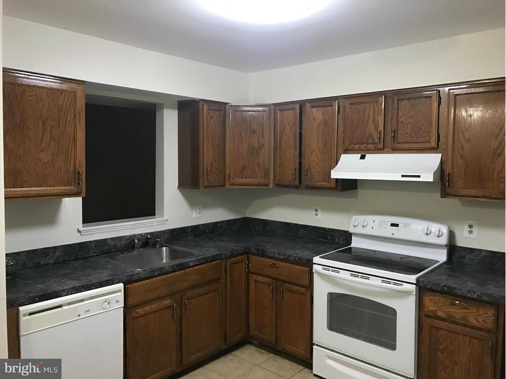 3355 Style Avenue Laurel, MD 20724 - Photo 4 of 15 a kitchen with a sink and cabinets