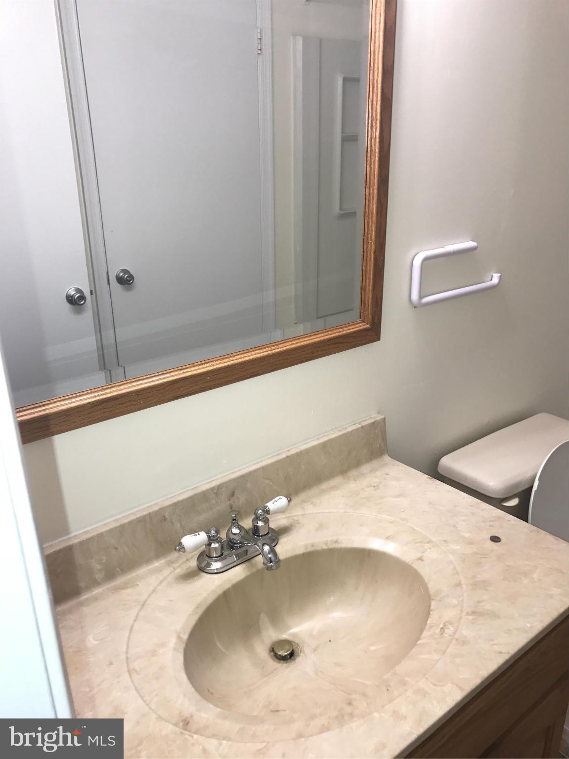 3355 Style Avenue Laurel, MD 20724 - Photo 8 of 15 a bathroom with a sink and a mirror