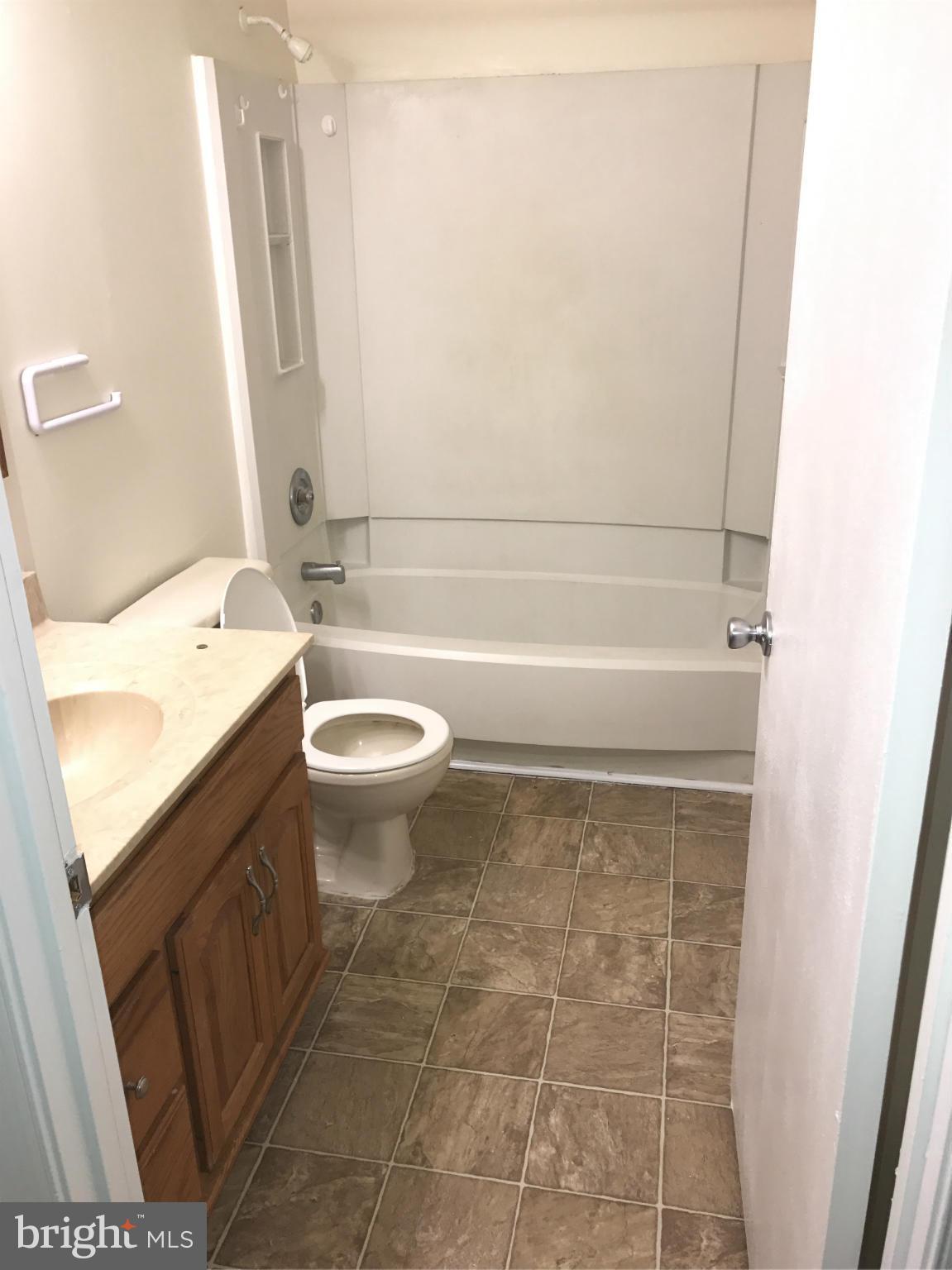 3355 Style Avenue Laurel, MD 20724 - Photo 9 of 15 a bathroom with a sink a toilet and shower