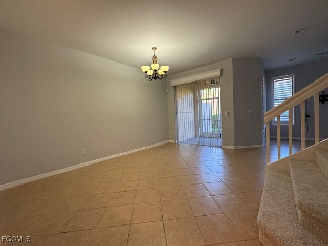4040 Cherrybrook Loop Fort Myers, FL 33966 - Photo 6 of 18 a view of an empty room with chandelier fan and wooden floor