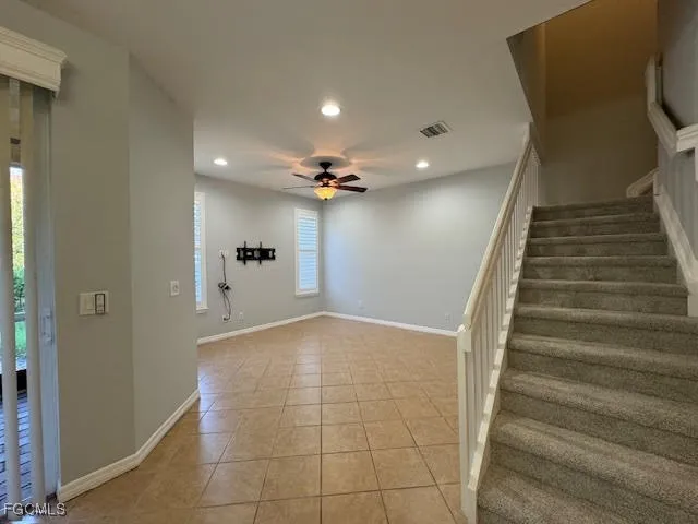 a view of a hallway with wooden floor and entryway