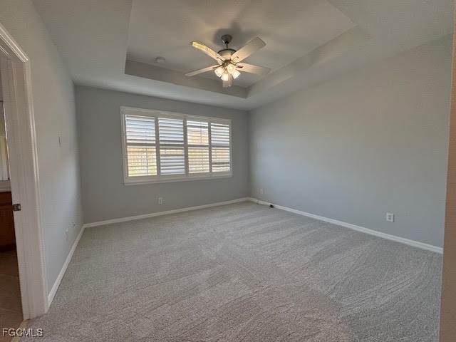 4040 Cherrybrook Loop Fort Myers, FL 33966 - Photo 9 of 18 an empty room with chandelier fan and windows