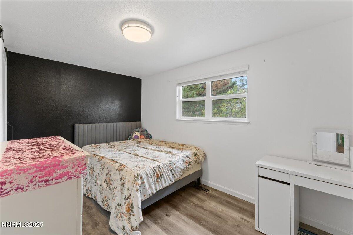 11720 Oregon Boulevard Reno, NV 89506 - Photo 13 of 45 a bedroom with a bed and a window