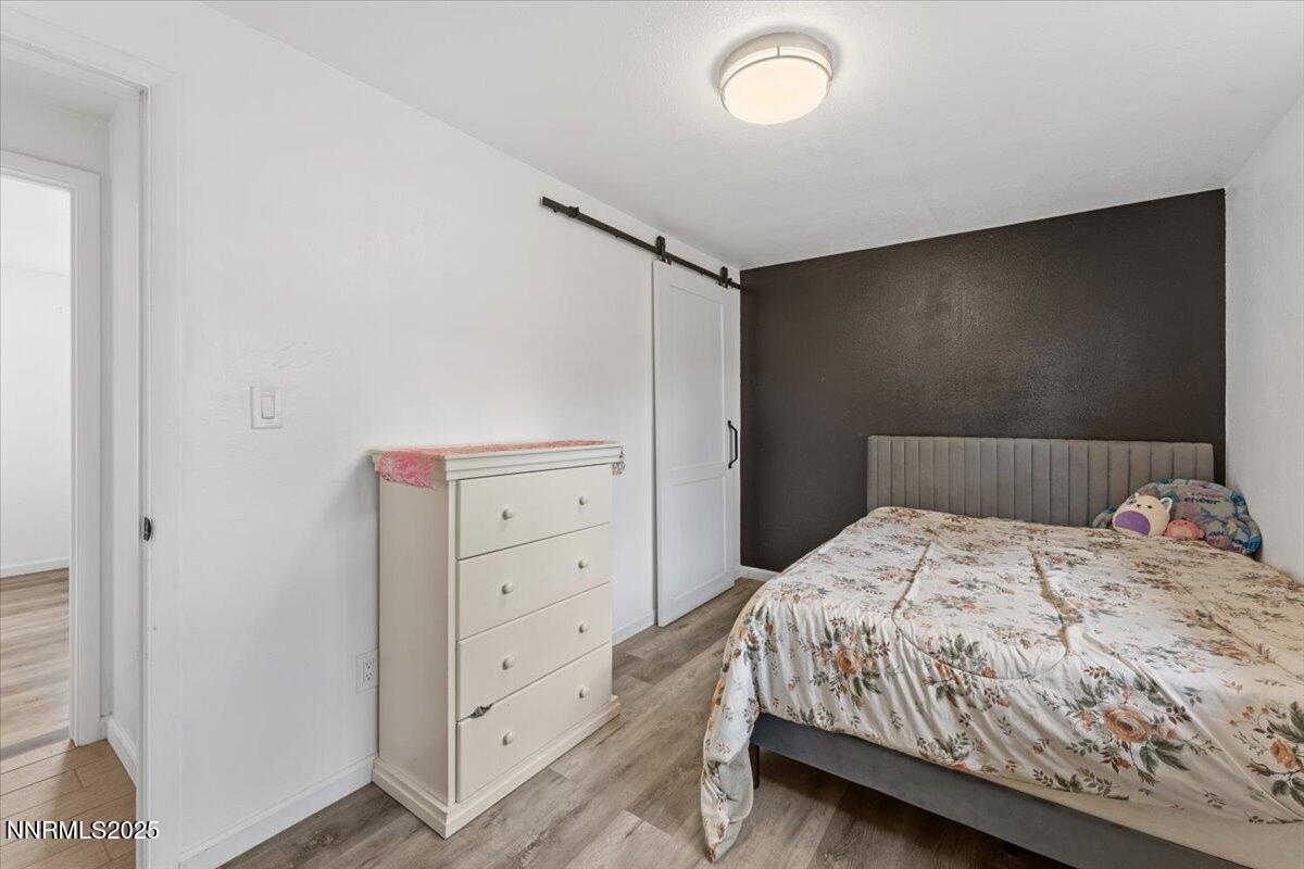 11720 Oregon Boulevard Reno, NV 89506 - Photo 14 of 45 a bedroom with a bed and a dresser