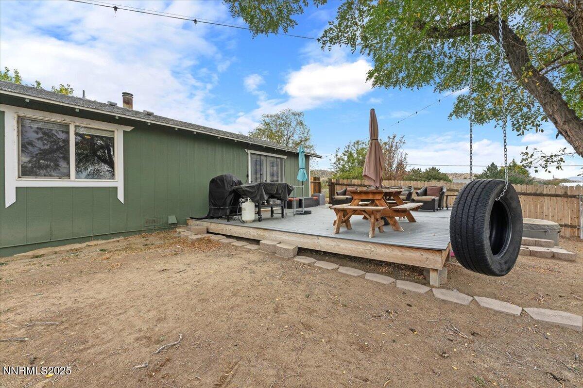 11720 Oregon Boulevard Reno, NV 89506 - Photo 20 of 45 a backyard of a house with barbeque oven fire pit table and chairs