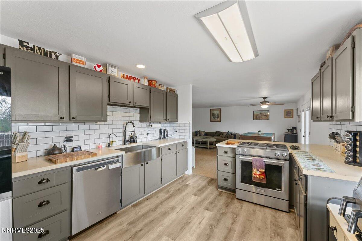 11720 Oregon Boulevard Reno, NV 89506 - Photo 8 of 45 a kitchen with a stove sink and cabinets
