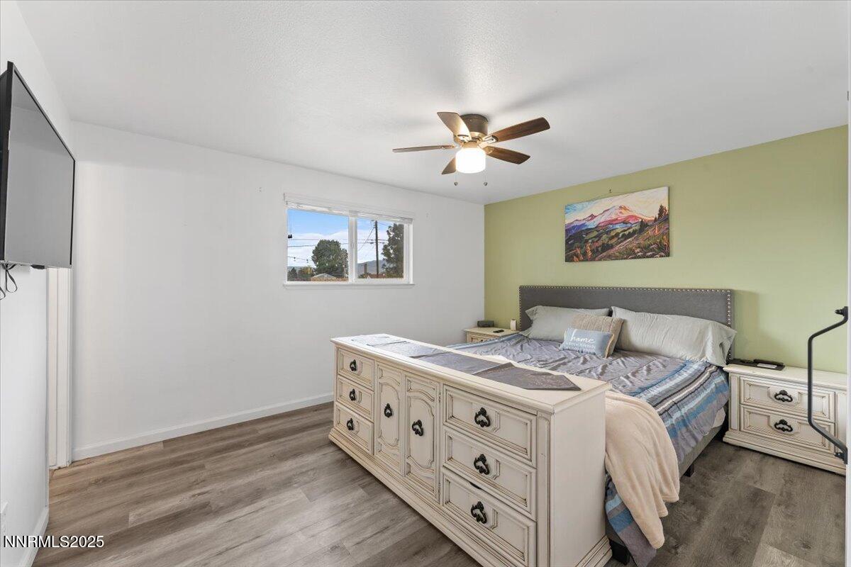 11720 Oregon Boulevard Reno, NV 89506 - Photo 9 of 45 a bed room with a bed and a chandelier