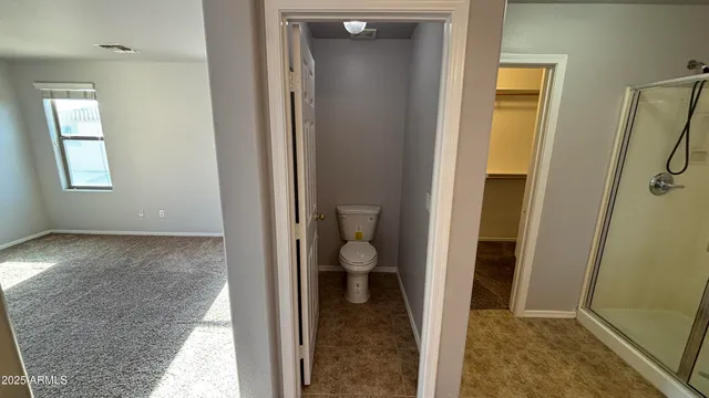 a view of a bathroom with toilet front door