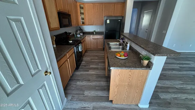 a view of living room and wooden floor