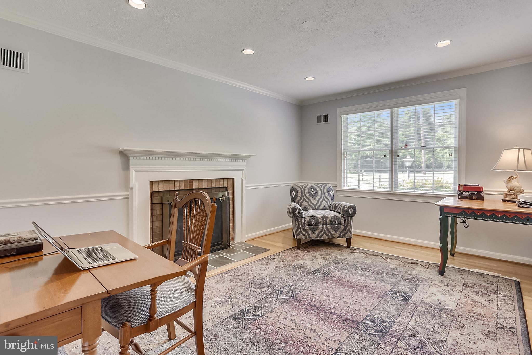 1900 Powder Mill Road Silver Spring, MD 20903 - Photo 11 of 57 Living room with fireplace and hardwoods