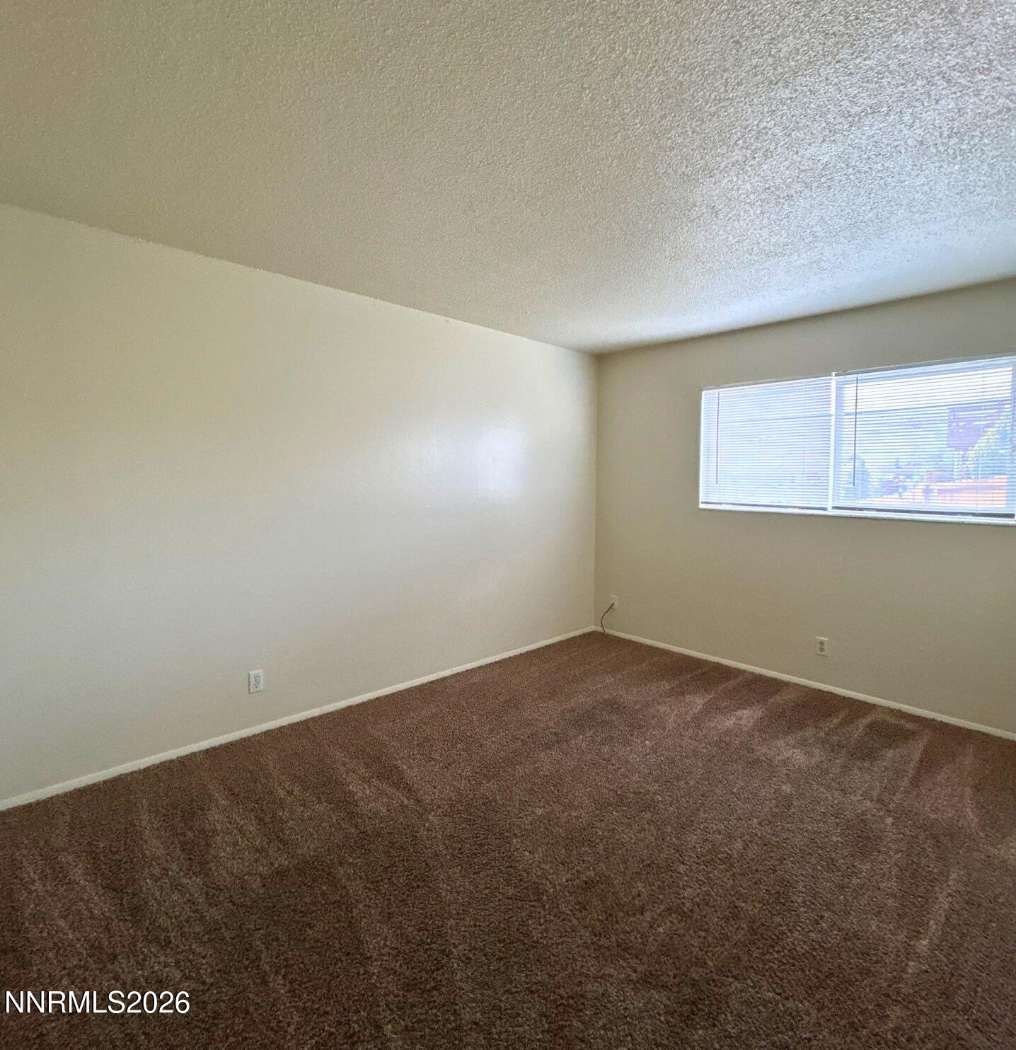 3285 Gypsum Road Reno, NV 89503 - Photo 12 of 17 an empty room with a empty space and window