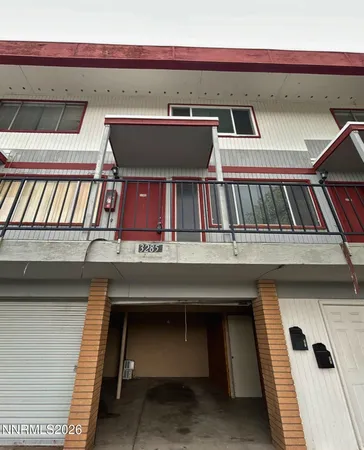 a view of a livingroom with a refrigerator