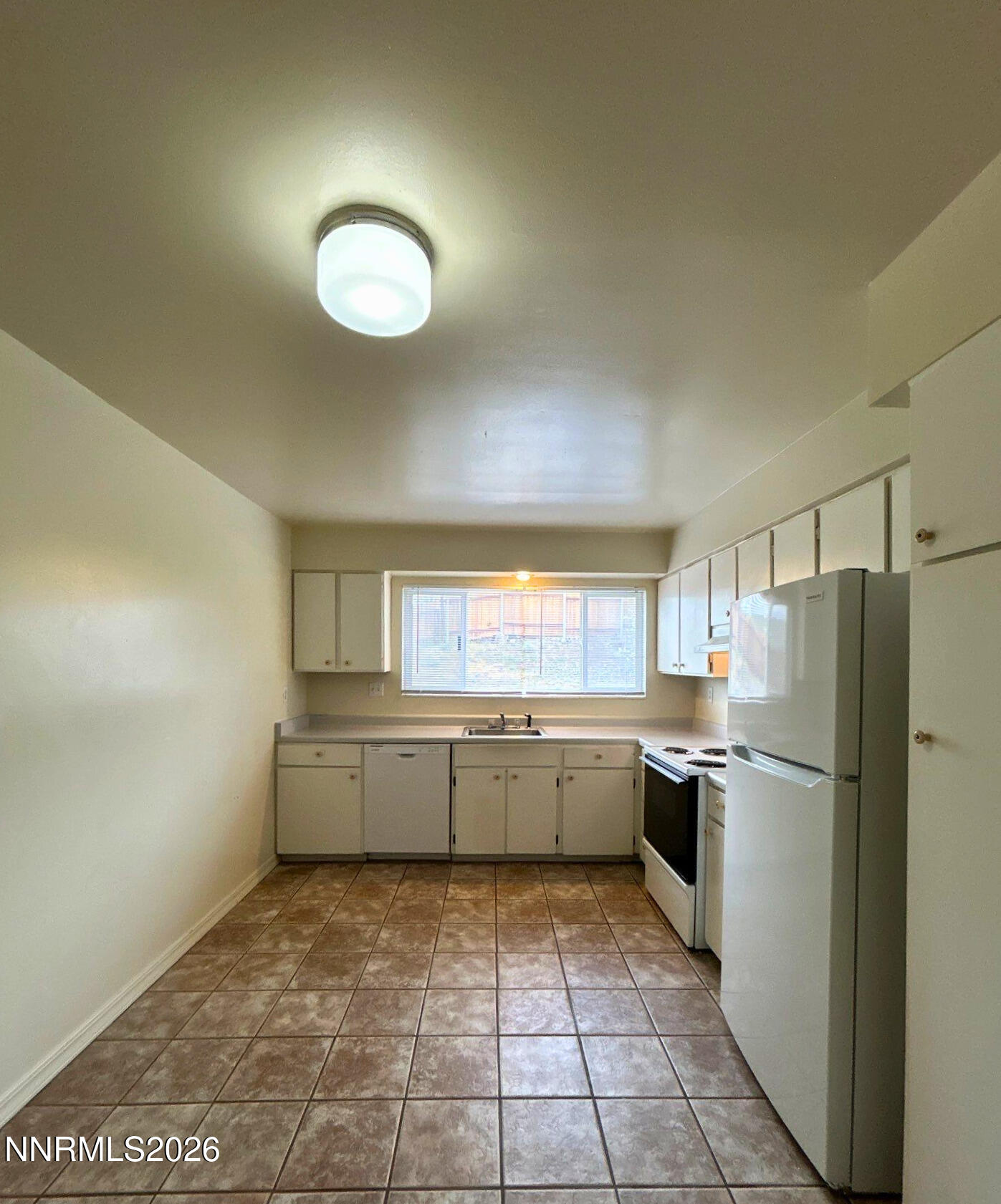 3285 Gypsum Road Reno, NV 89503 - Photo 2 of 17 a kitchen with a refrigerator and countertop