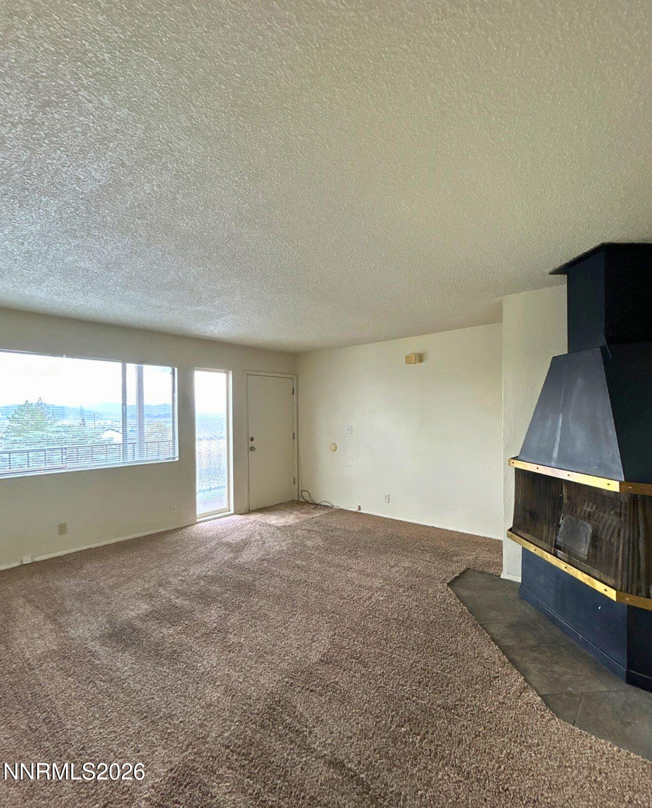 3285 Gypsum Road Reno, NV 89503 - Photo 5 of 17 a view of an empty room with a window