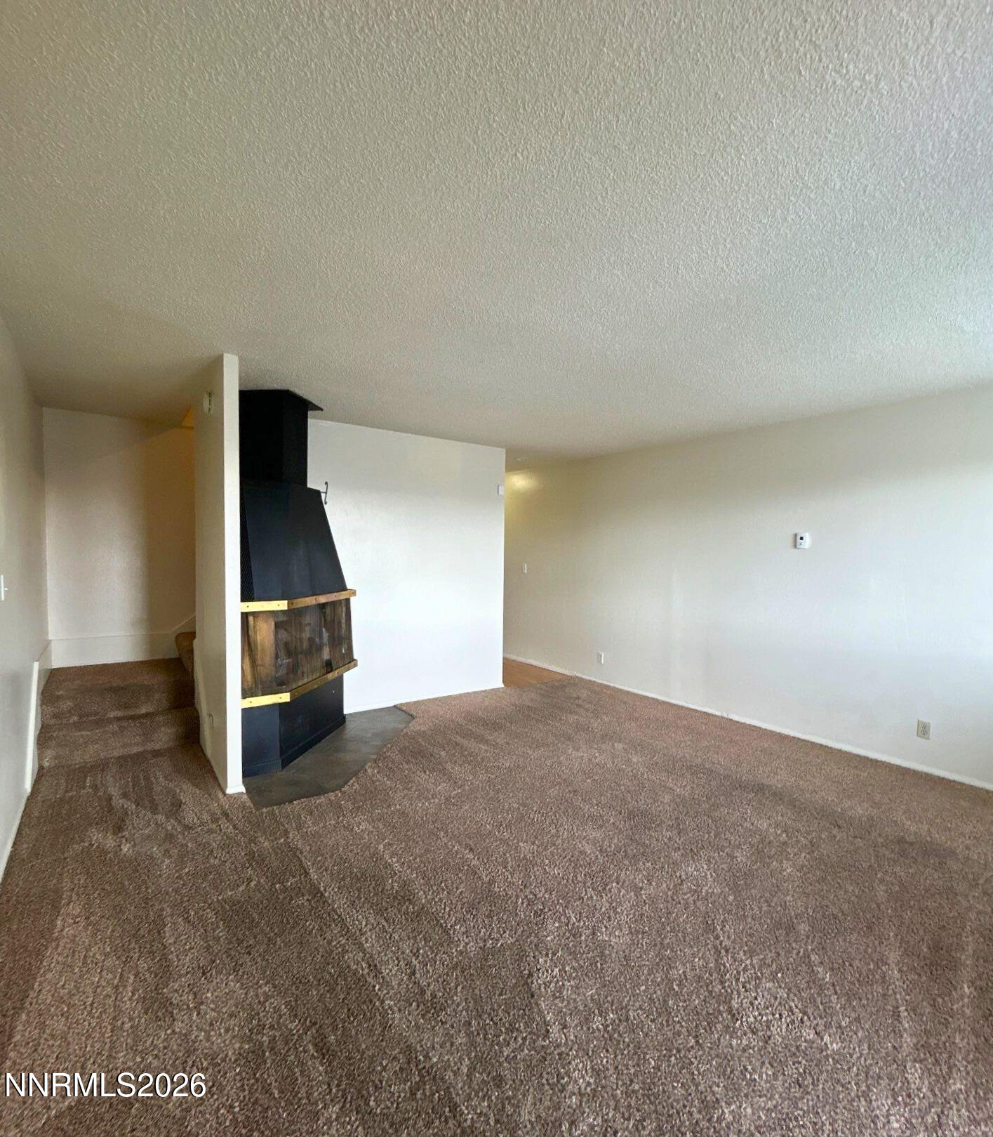 3285 Gypsum Road Reno, NV 89503 - Photo 7 of 17 a view of empty room with a ceiling fan
